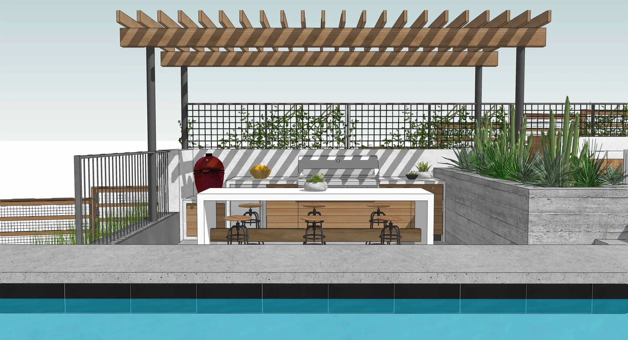 Poolside outdoor kitchen and bar facing the water