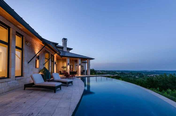 Infinity edge pool at dusk overlooking the Austin Hill Country — Art House by Modern Pools