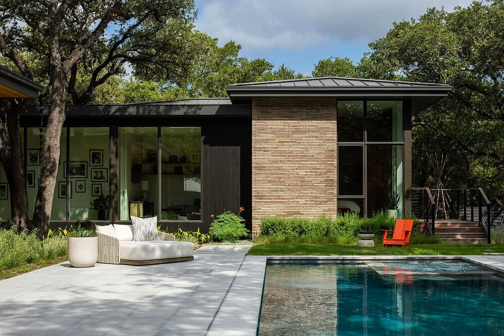 Small inground pool beside a modern Austin home