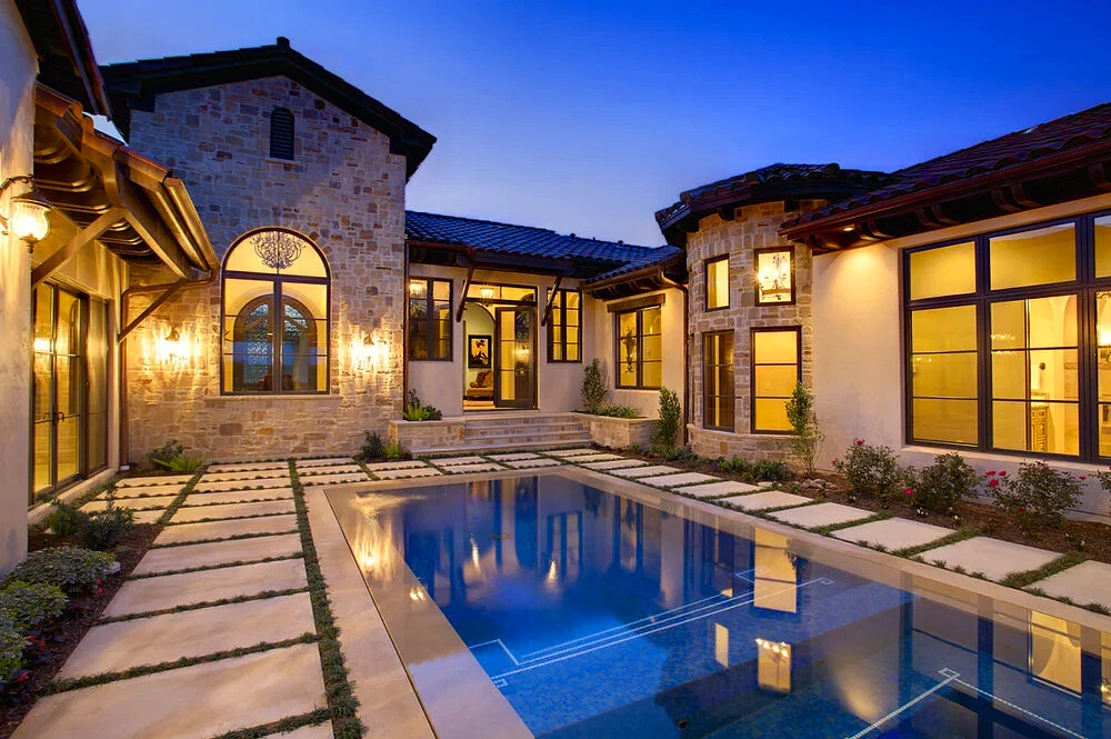 Remodeled custom pool with refinished interior and new coping by Modern Pools in Austin