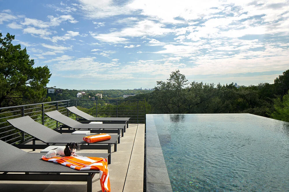 Infinity edge pool overlooking the Austin Hill Country, built by Modern Pools